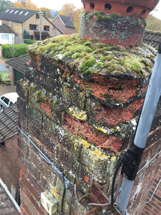 Repaired chimney stack with restored brickwork and repointed mortar after professional chimney repairs in Hertfordshire.