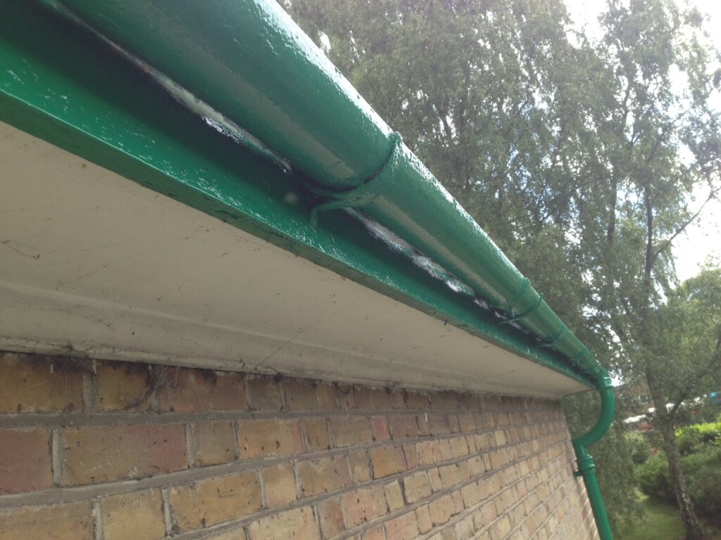 Professionally refurbished and repainted guttering after restoration on a residential property in Hertfordshire.