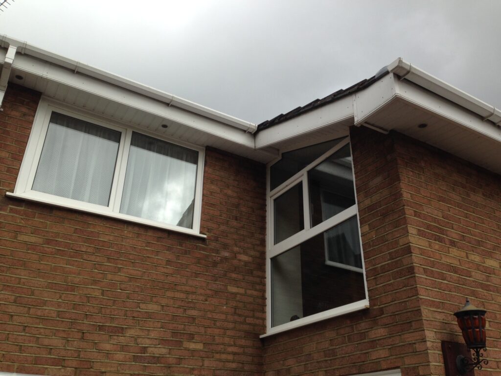 Newly refurbished white guttering, fascias and soffits after professional exterior refurbishment on a home in Hertfordshire.
